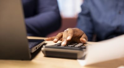 man-woman-reviewing-bills-financial-documents-track-expenses-scaled.jpg